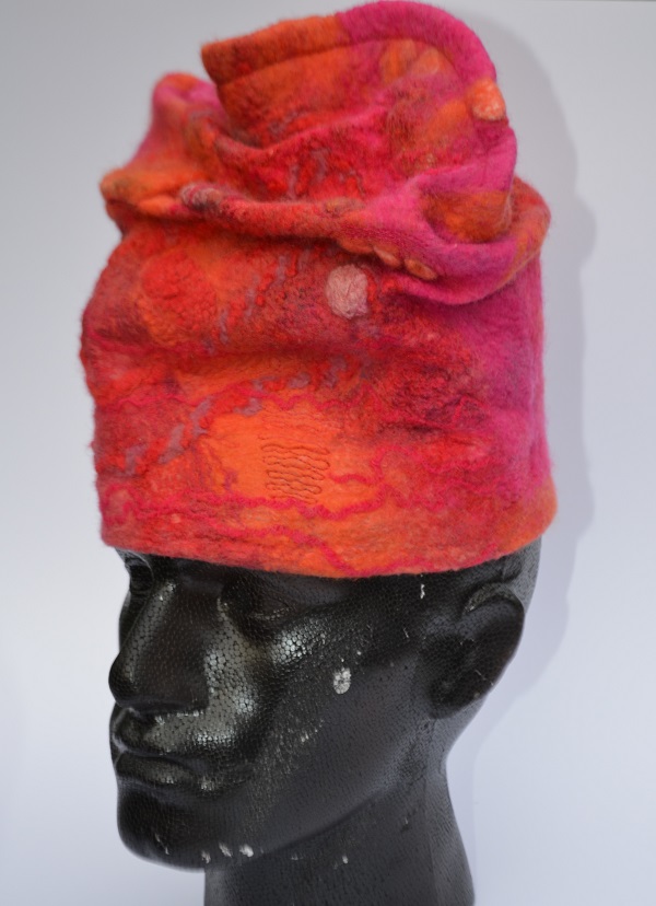Red hat in felt on model by Pearl Taylor