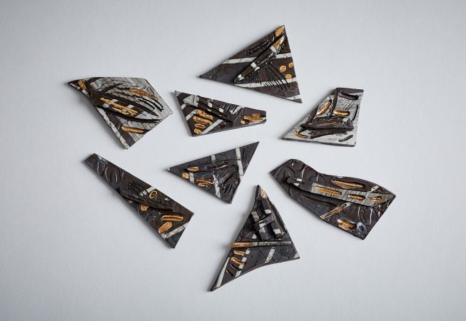 Clay shards with slip trailing and lustre glaze