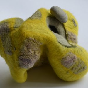 Sculptural felt nestling stone