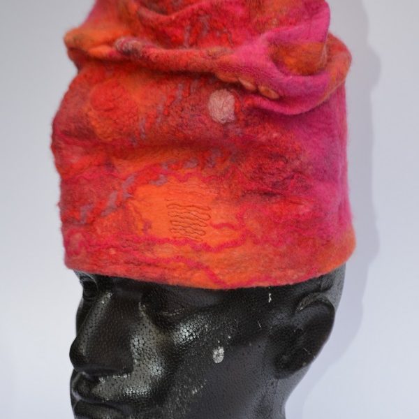 Red hat in felt on model by Pearl Taylor