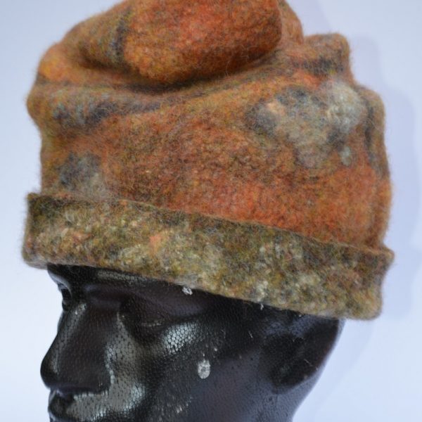 Rust-coloured felt hat on model by Pearl Taylor
