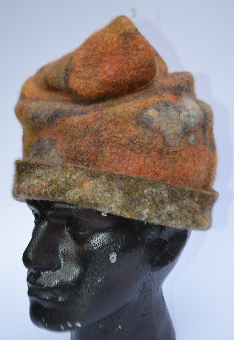 Rust-coloured felt hat on model by Pearl Taylor